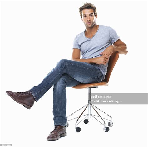 a man sitting on a chair|human sitting on chair.